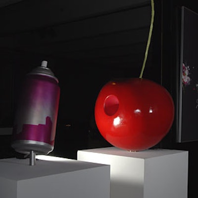 Charlie Becker’s “Cherry Pop” sculpture anchored the exhibit in the center of the gallery space.