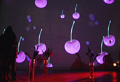Projected onto the gallery’s white walls was a scrolling animation of cherries, designed by Strategic Group.