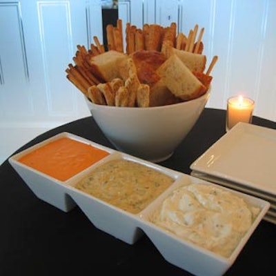 Colourful foods such as bread sticks and red pepper, hummus, and creamy eggplant dips added to the decor.