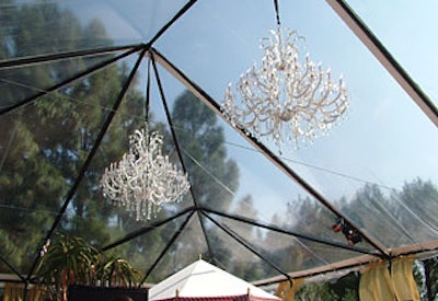 Crystal chandeliers hung from a clear tent at the Haven house.