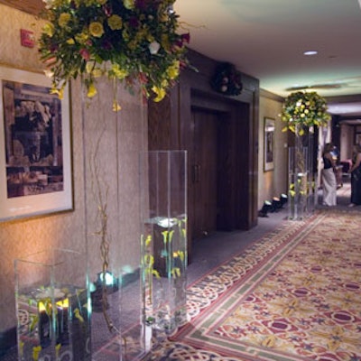 The entrance was kept simple with yellow, red, and green trees submerged in clear acrylic containers.