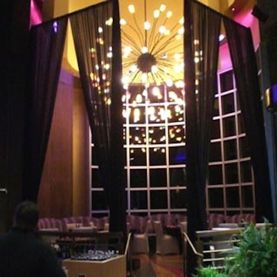 There were private stage areas to both the left side and the right side of the stage, which featured black drapes and unique chandeliers.