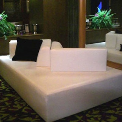 The leather couches provided by Room Service inside the Jeter lounges contrasted black pillows with white couches and vice versa.
