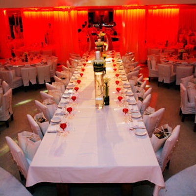 The tables and chairs were blanketed in white and topped with roses during the VIP dinner.