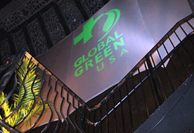 Global Green's logo showed on giant white screens in the V.I.P. balconies.