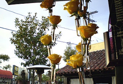 To decorate the cocktail space Gabriel Pacheco arranged yellow roses in test tube-like vessels.