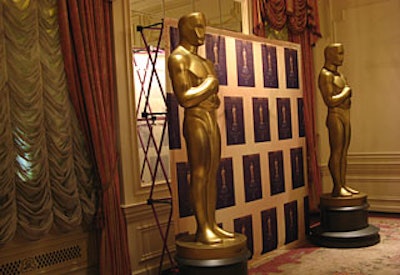 Two eight-foot-tall Oscar statues (which arrived earlier in the week) stood in the cocktail area of the Louis XVI suite of the St. Regis for the Academy’s affair.
