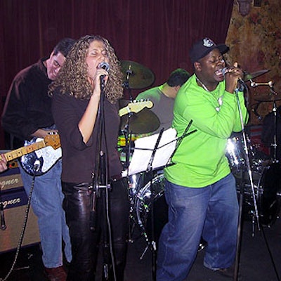 Mindshare's Carrie Abramson and Jos. H. Carter's Evan Kremin performed 'You Can Leave Your Hat On' with the Cats, a band made up of media and advertising employees.