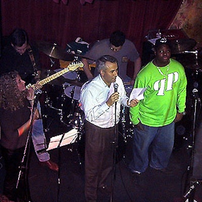 E! Networks' Dave Cassaro, a member of the event's executive committee, spoke to the crowd before a performance by the Cats.
