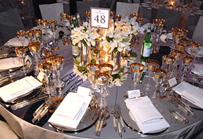 Antony Todd's design included mirrored tabletops and simple white flowers.