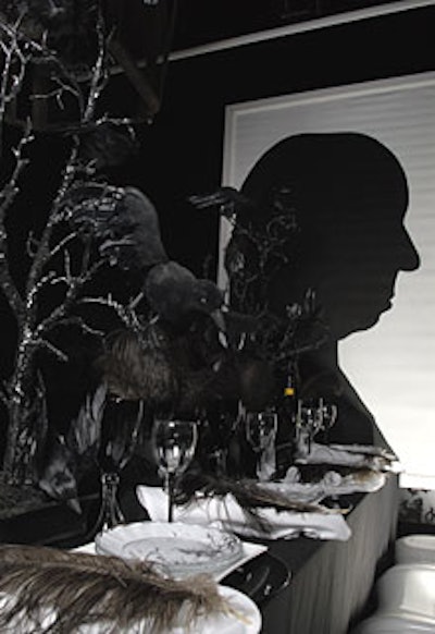 Tracy Stern, creator of SalonTea, used a common design element (birds) to cast a dramatic vibe with her black-and-white tribute to Alfred Hitchcock's The Birds. Stern set the moody scene with a large centerpiece of crows perched ominously on twisted branches. Black plumage was placed at each person’s place setting (the plates alternated between silhouettes of birds and Hitch's famous profile) and scattered across the floor.