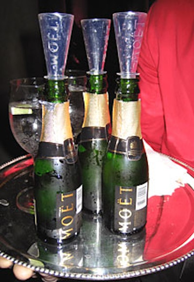 Sponsor Möet & Chandon provided champagne poppers—miniature bottles of bubbly with a plastic flute attached to the top. The poppers, which attendees swigged like a beer bottle, reminded us more of an English pub than a garden party.