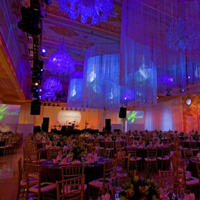 The ballroom featured two jumbo screens, fringed chandeliers, and a staging area.