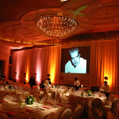 In the grand ballroom, guests were greeted by a large screen showing black-and-white photographs of the evening's guests of honor.