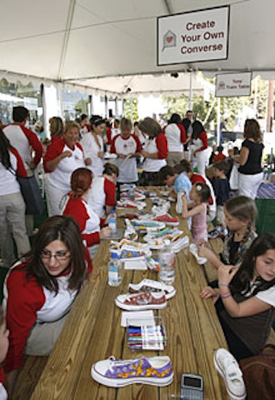 Diva Arts artists gave kids glitter and airbrushed tattoos and helped them decorate Converse sneakers donated by the sportswear company and event partner.