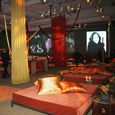 Surrounded by delicate chiffon and silk fabrics and plush pillows, large projections of stills from The Namesake and director Mira Nair decorated three walls.