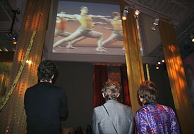 A yoga video from the Iyengar Yoga Association of Greater New York, best visible from the studio’s balcony, represented the group at the event, while a separate video about Nair’s program Maisha played in a side room.