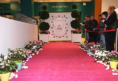 Best’s logo backed the bright pink carpet where “Very Important Bunnies” arrived. Stroud lined the carpet with pink and white azaleas and hand-colored eggs.