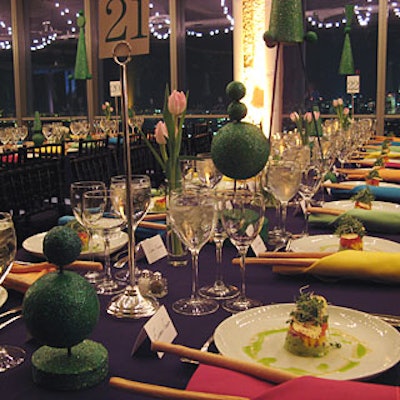 To emulate the suburban environment featured in Matthew Bourne’s production (not to mention the 1990 Tim Burton film that inspired it), Josh Hickey created a backyard picnic table setting, complete with candy-colored napkins and simple tulip centerpieces.