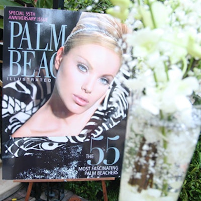 Several oversize Palm Beach Illustrated magazine covers, mounted on laminated foamcore, were displayed throughout the courtyard, including the one being launched that day.