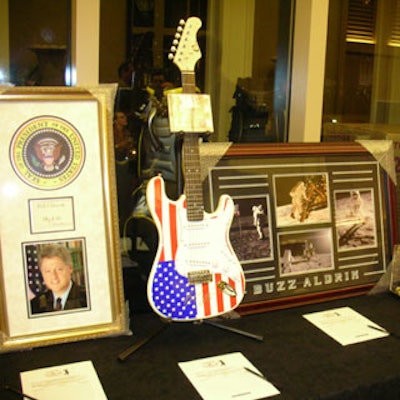 Silent auction items at the event ranged from a signed Jimi Hendrix guitar to Buzz Aldrin and Bill Clinton frames.