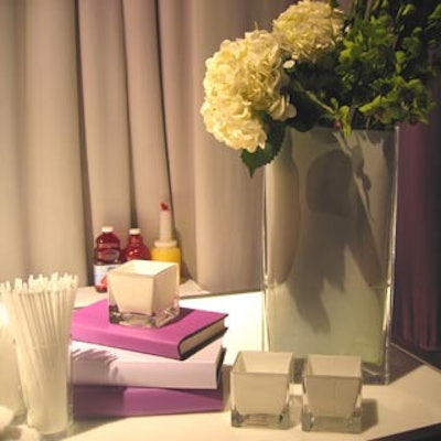 MMD created vignettes of books and florals in the fashion show lounge area.