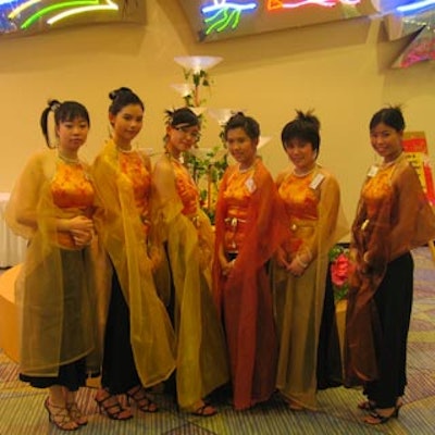 Greeters wore designer gowns from Gloria Chan and Victoria Cheung.