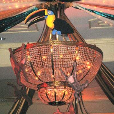 The ballroom's central chandelier was embellished with a colorful toucan and several monkeys.