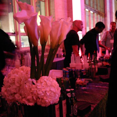 Arrangements of white lilies flanked the bar stations.