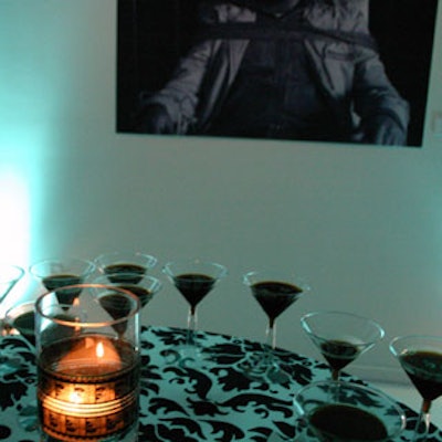 The evening's theme was illuminated by votive candles placed inside glass jars festooned with film reels. They are shown here encircled by espresso martinis.