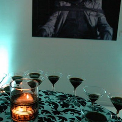 The evening's theme was illuminated by votive candles placed inside glass jars festooned with film reels. They are shown here encircled by espresso martinis.
