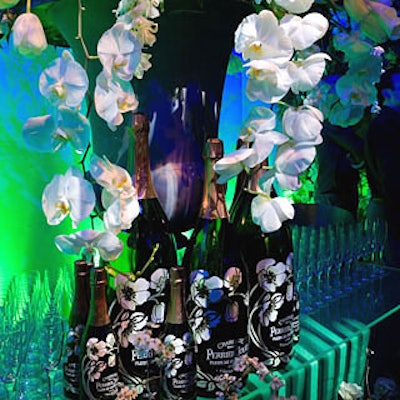 The party’s abundant white flowers referenced those that adorn the champagne’s logo, as well as the drink’s bottle, designed by Emile Gallé in 1902.