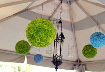 Flowers arranged in globe shapes hung from the ceiling for splashes of bright color.