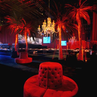 Plush red fabric covered round bench seating.