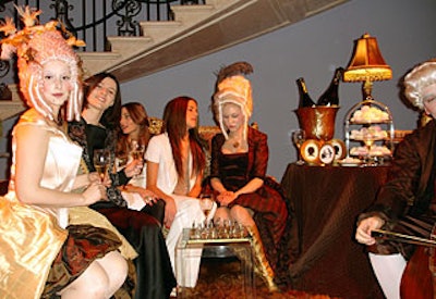 The hosts invited guests to be photographed with the models, giving the portraits as gifts at the end of the evening.