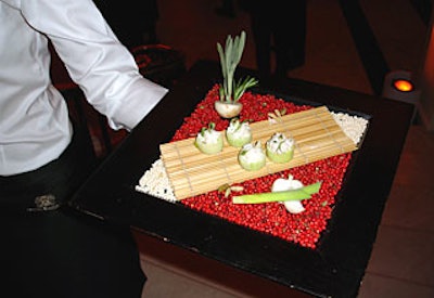 Guests nibbled on canapés, including Maine peekytoe crab with green apple gelée in cucumber cups, and sipped Dom Ruinart on the first floor before heading upstairs for an elaborate dinner.