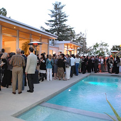 Guests mingled poolside at the kickoff party for Metropolitan Home’s L.A. show house.