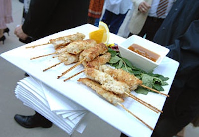 Crumble Catering passed hors d’oeuvres like chicken skewers.