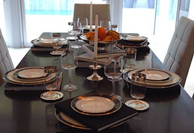 Books stacked alongside plates and chargers gave the dining table a whimsical look.