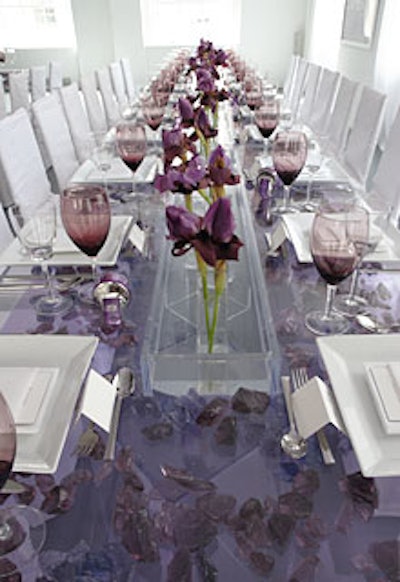 Two 40-foot Lucite tables filled with purple quartz stones dominated the lunch space. Large purple irises in slim vases sat in the center of the tables.