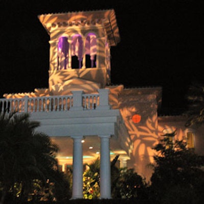 Before guests even arrived, they could see a purple-lit bell tower and large tropical palm fronds projected onto the building.
