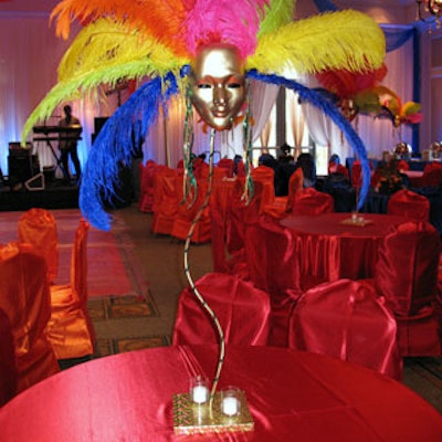 Centerpieces in the ballroom, like the tall one featured here, were concocted out of Carnivale masks.