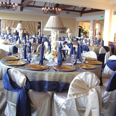 The dining tables featured glass cylinder centerpieces filled with rawhide dog bones topped with a beige shade and an LED light at the base to provide extra illumination.