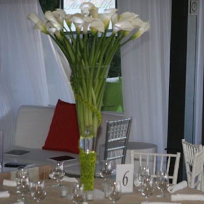 The height of the centerpieces was enhanced by tall fluted glass vases.