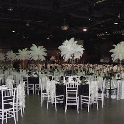 Alternating black and white dining tables made a dramatic impact in the massive room.