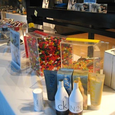 Assorted candies in clear containers on product display tables featured wrappers that asked the question, 'What are you into?'