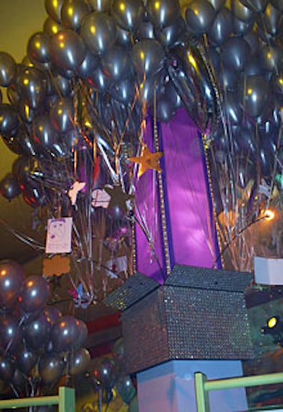 Children contributed content to the after-party’s towering Imagination Station centerpiece, marking its walls and attaching artwork to its silver balloons.
