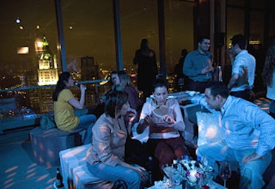 Planners arranged groupings of low banquettes and ottomans near the windows so guests could enjoy the view-once the fog cleared.