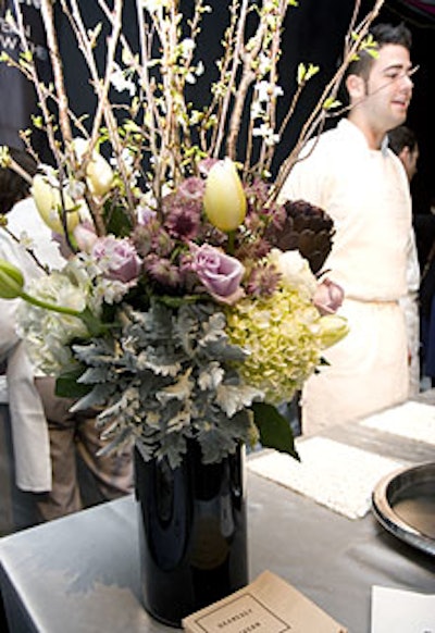 Soft-hued arrangements of spring blooms (and the occasional artichoke) added a pretty, natural touch to the otherwise spare decor.