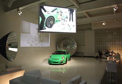 In a predominantly white, modern setting at Splashlight Studios populated by leather sofas and ottomans, Porsche suspended stylish images of its new car, shot in the very same space just two weeks prior for a special issue of fashion and design magazine Clear.